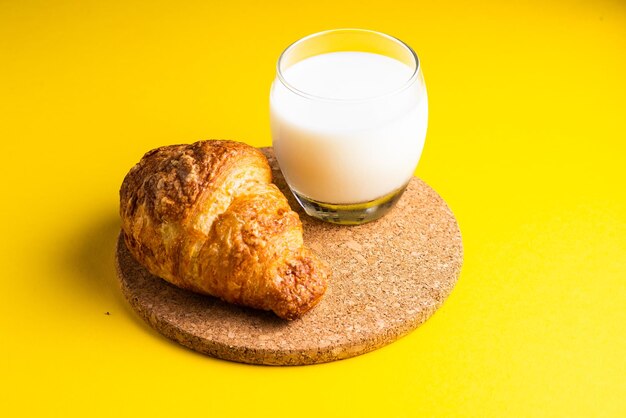 Wheat bread breakfast and milk in morning croissant plate