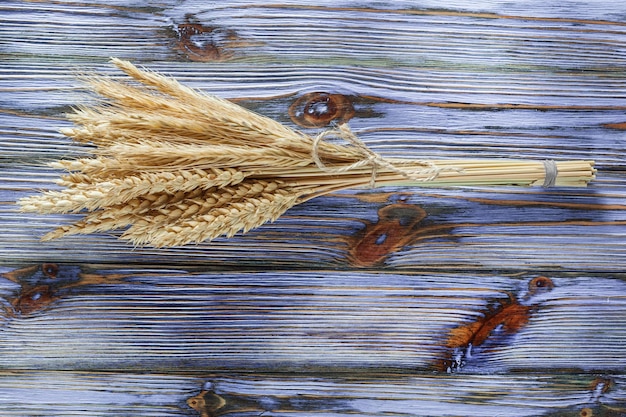 Wheat ears on vintage wooden board