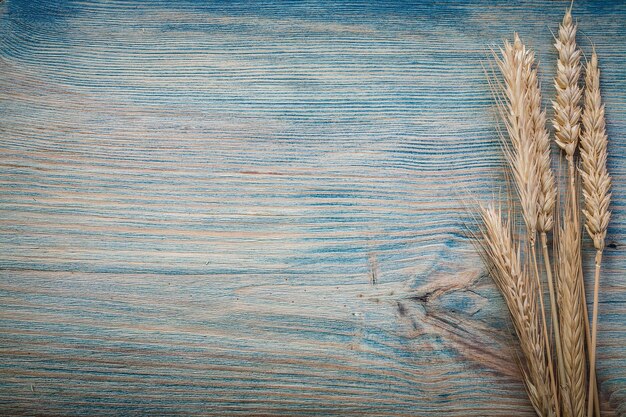 Wheat ears on wood