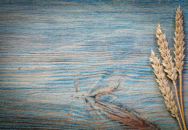 Wheat ears on wood