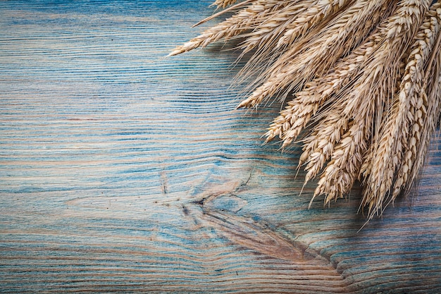 Wheat ears on wood