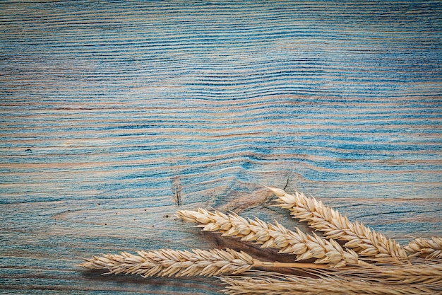 Wheat ears on wood