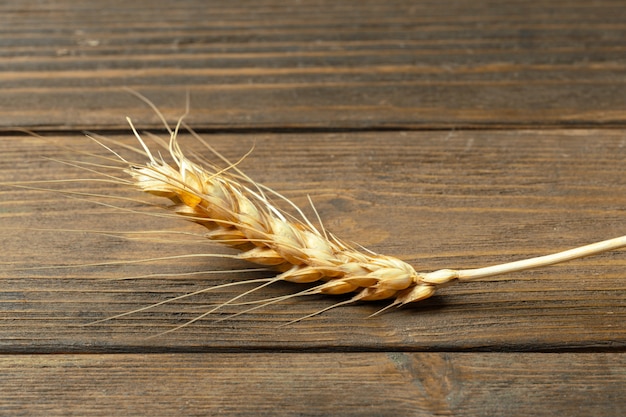 Wheat Ears on the Wooden Table