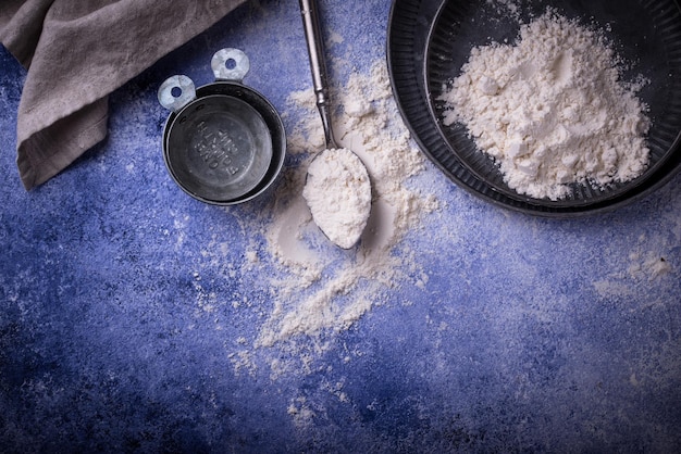 Wheat flour on dark baking background