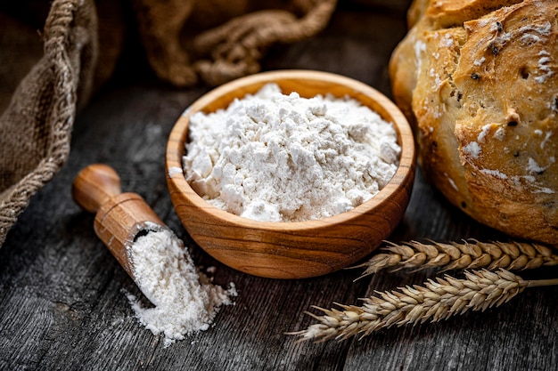 Wheat flour on an old wooden table