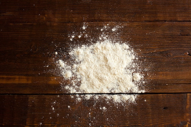 Wheat flour for preparing bakery products on the wooden table