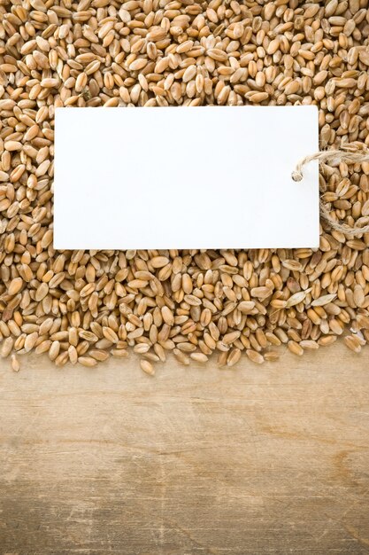 Wheat grain and tag price on wood