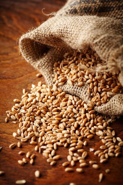 Wheat grain on wooden table