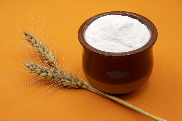 wheat grains and wheat flour in bowl