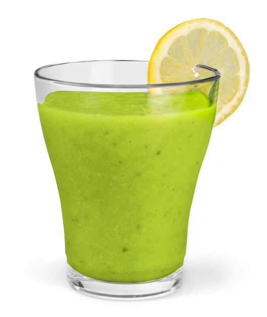 Wheat grass juice with lemon slice in glass on white background