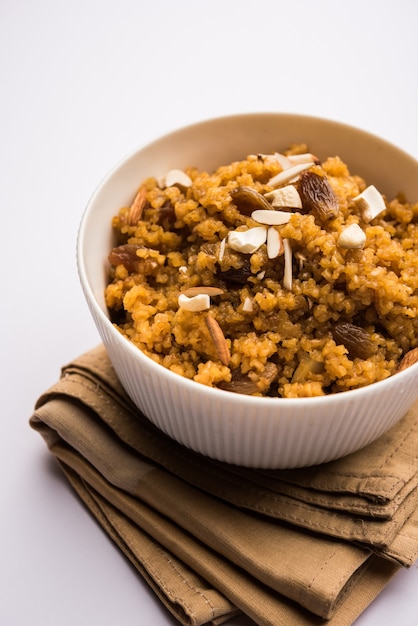 Wheat Laapsi or Lapsi or Shira or Halwa is an Indian sweet dish made of broken wheat or Daliya pieces and ghee along with nuts, raisins and dried fruits