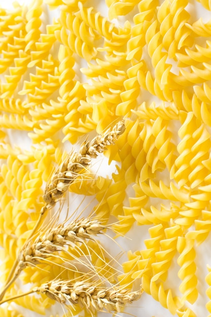 Wheat and pasta on a white background