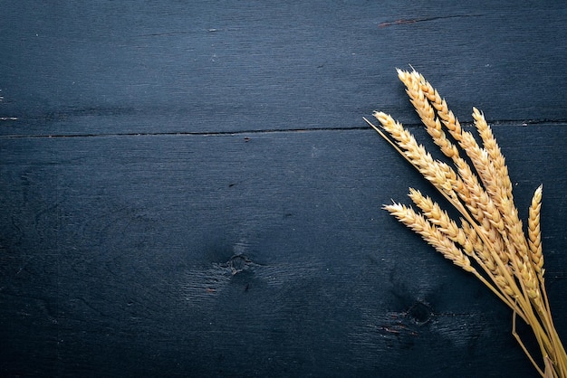 Wheat on a wooden background Top view Free space for text