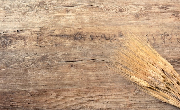 Wheat on wooden background