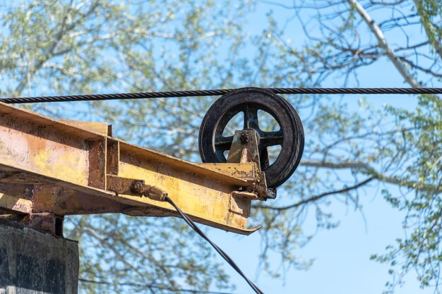 Wheel abandoned cableway for transporting people in park old obsolete suspension road across river