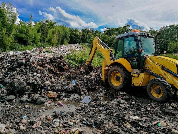 Wheel loader digging gabage at the landfill.