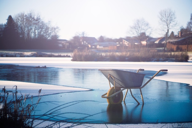 Wheelbarrow on frozen lake