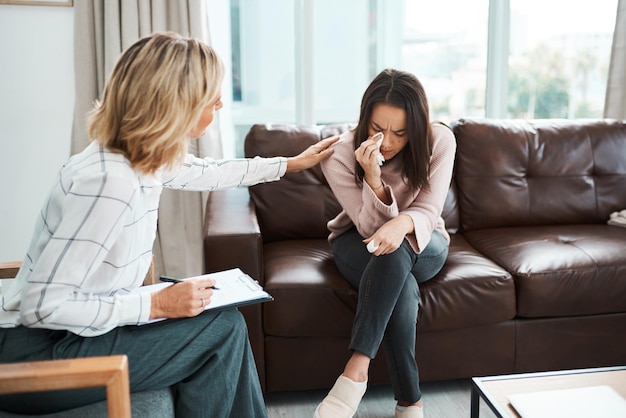 When you start talking you start healing Shot of a crying young woman being comforted by her psychologist during a therapeutic session