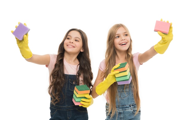 Where sponges work best. Small housekeepers holding dish sponges in yellow rubber gloves. Little girls enjoy washing dishes with kitchen cleaning sponges. These scrubbing sponges wont scratch.