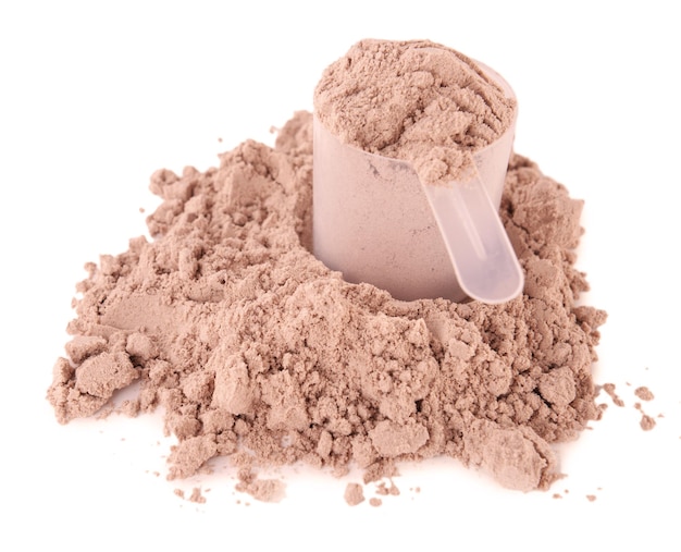 Photo whey protein powder in scoop isolated on white