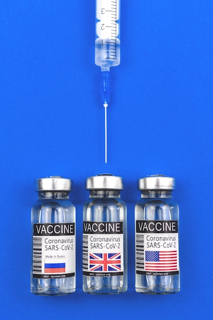Which vaccine to choose for vaccination, COVID-19 coronavirus pandemic concept photo with vaccine from American, UK or Russia countries