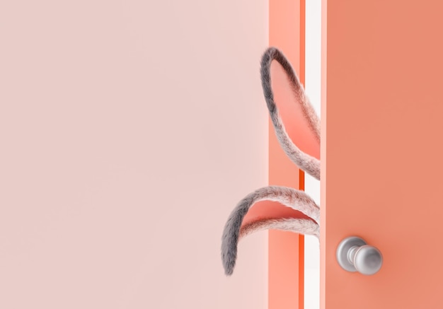 Photo whimsical bunny ears hiding behind peach door whit copyspace