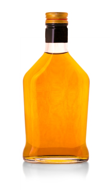 Whiskey bottle isolated over a whte background 