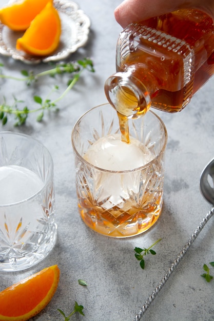 Whiskey, brandy or bourbon alcohol drink in crystal glasses