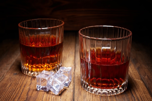 Whiskey in a glass on wooden table