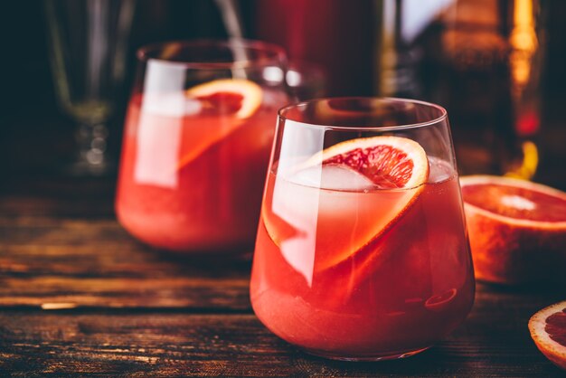 Whiskey sour cocktail with aged bourbon, blood orange juice and cherry syrup