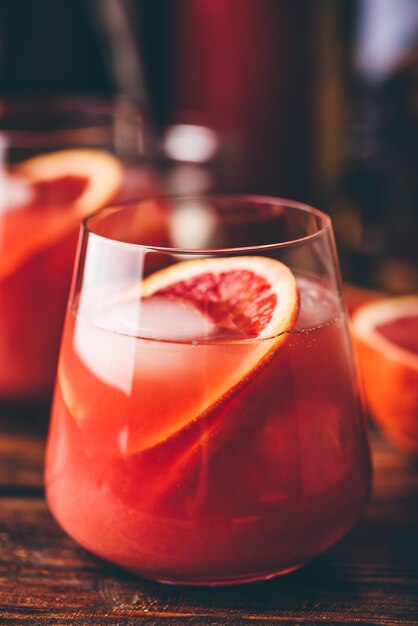 Whiskey sour cocktail with aged bourbon, blood orange juice and cherry syrup