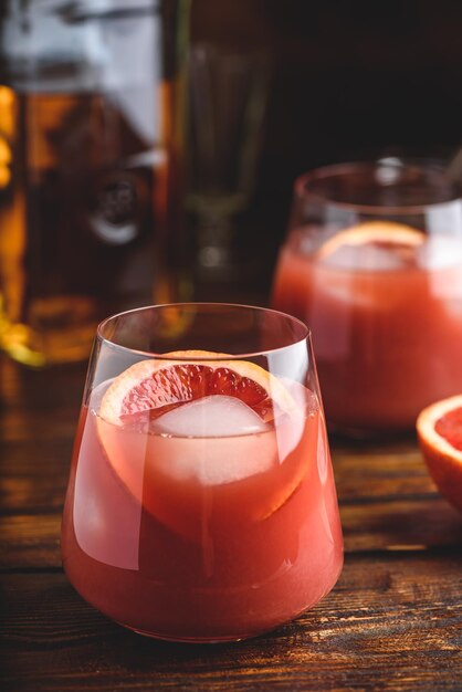 Whiskey sour cocktail with aged bourbon blood orange juice and\
simple syrup