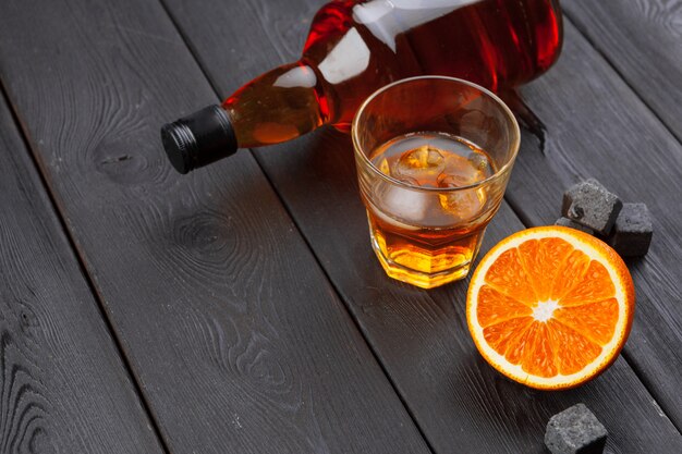 Whiskey and whiskey stones on a wooden table