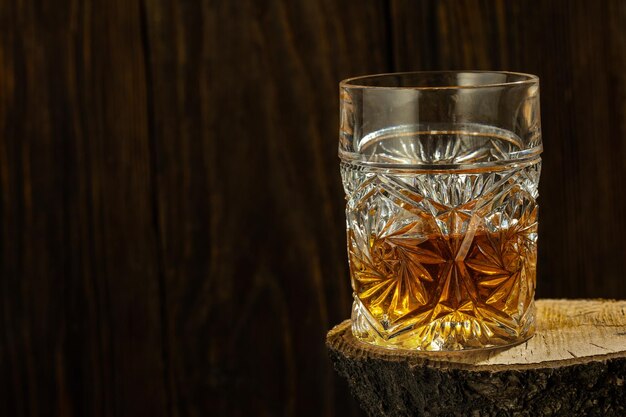 Whiskey with Ice on a Wooden Table