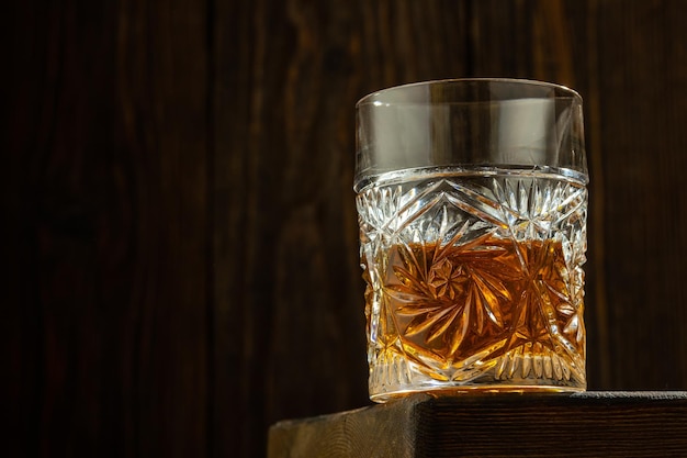 Whiskey with Ice on a Wooden Table