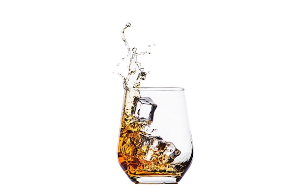 Whisky in glass with splashes