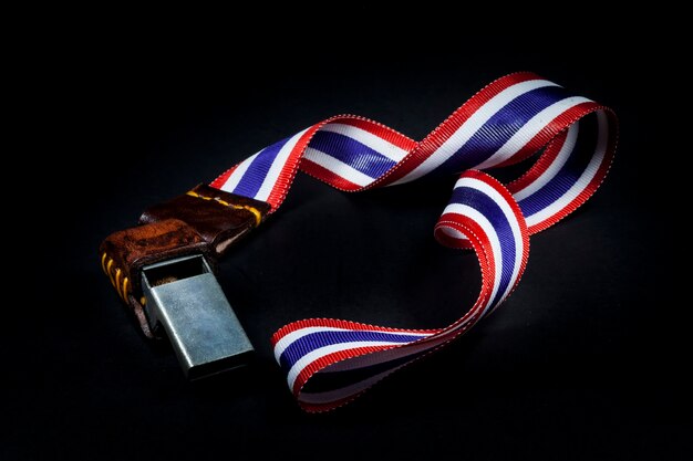 Whistles with Thailand national flag lanyard on black background