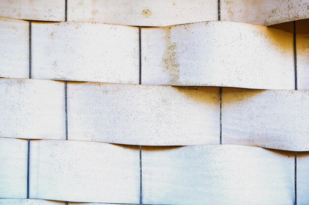 White abstract stone background Old wavy tile