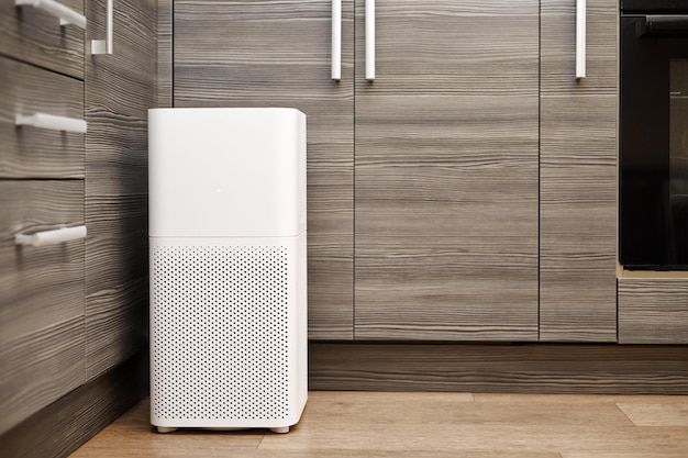 White air purifier in the kitchen of the apartment