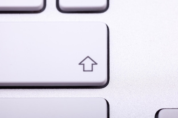 White aluminum keyboard in close up. technology and communication