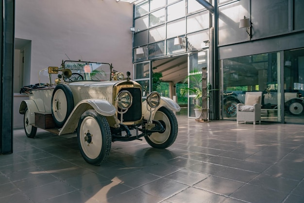 White antique car in the showroom