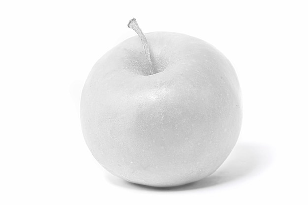 Photo white apple on a white background colorless fruit winter fruit