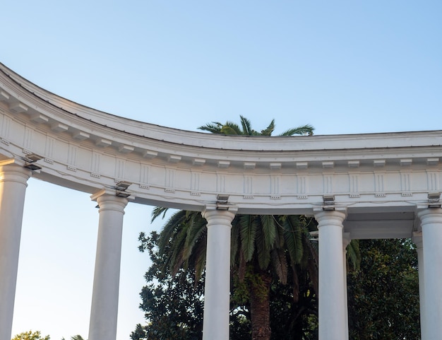 White arch and lanterns on it Architectural ensemble Decorative building Arch at the entrance to the park