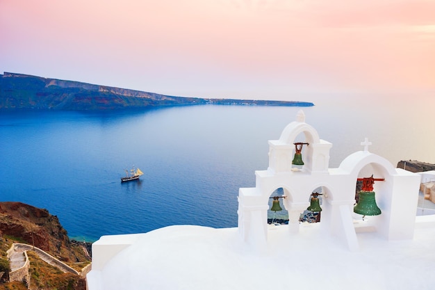 White architecture on Santorini island, Greece. Beautiful summer landscape at sunset, sea view