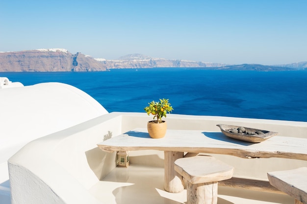 White architecture on Santorini island, Greece. Beautiful terrace with sea view.