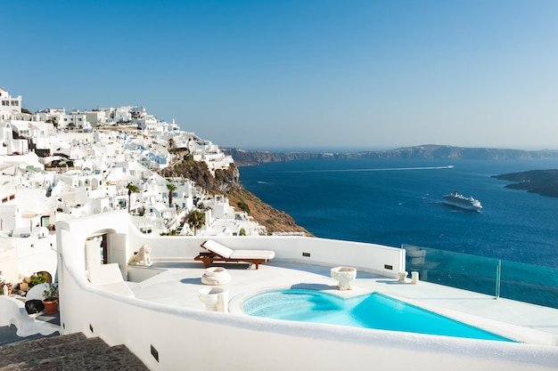 White architecture on Santorini island Greece Luxury swimming pool with sea view