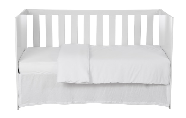 white baby crib with duvet isolated on white background.