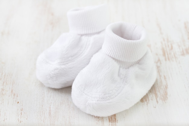 White baby socks on white surface