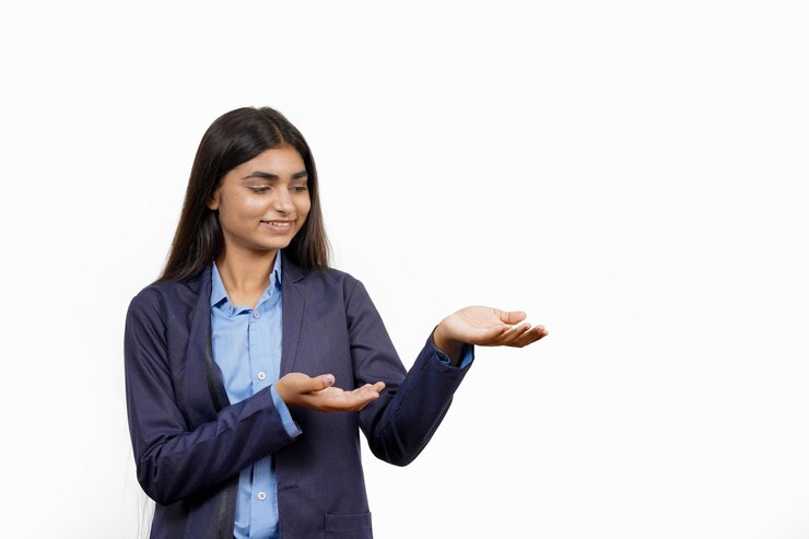 Photo on a white background a businesswoman poses with something while an asian beauty watches