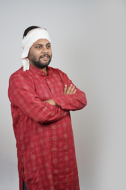 On a white background an indian farmer is showing expression